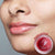 Manjistha Lip Balm من iYURA لتوحيد لون Manjistha Lip Balm وتصبغها